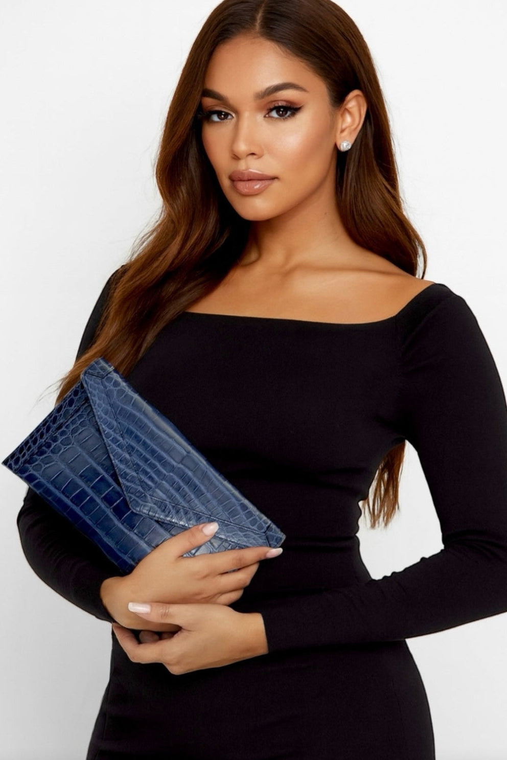 The Morgan clutch is the embodiment of effortless elegance—crafted for the woman who values simplicity without sacrificing luxury. Streamlined yet versatile, its silhouette is large enough to hold your phone and essentials, making it the perfect companion for a day of errands, an evening soirée, or a night on the town.