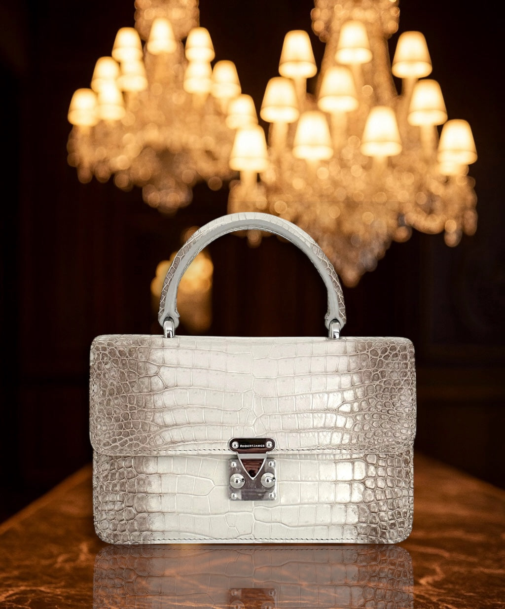 TIMELESS, ELEGANT, AND SOPHISTICATED—THESE ARE JUST A FEW WORDS THAT DEFINE THE STUNNING ANKA BY ROBERTJAMES. CRAFTED FROM AN EXQUISITE SELECTION OF EXOTIC SKINS, THE ANKA IS THE EPITOME OF LUXURY AND PRACTICALITY, MAKING IT THE PERFECT ADDITION TO ANY DISCERNING COLLECTOR’S WARDROBE.